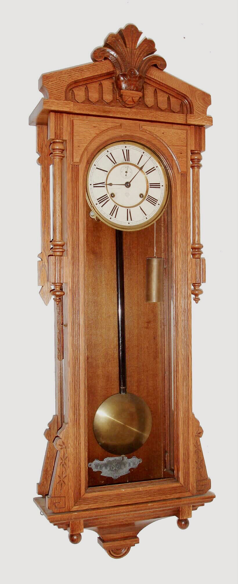 Ansonia Clock Co., Brooklyn, New York, "Bagdad", wall clock, 8 days, time only, two weight driven movement in an oak case with papered metal dial and second's bit, c1890 — Antique Clocks Price Guide