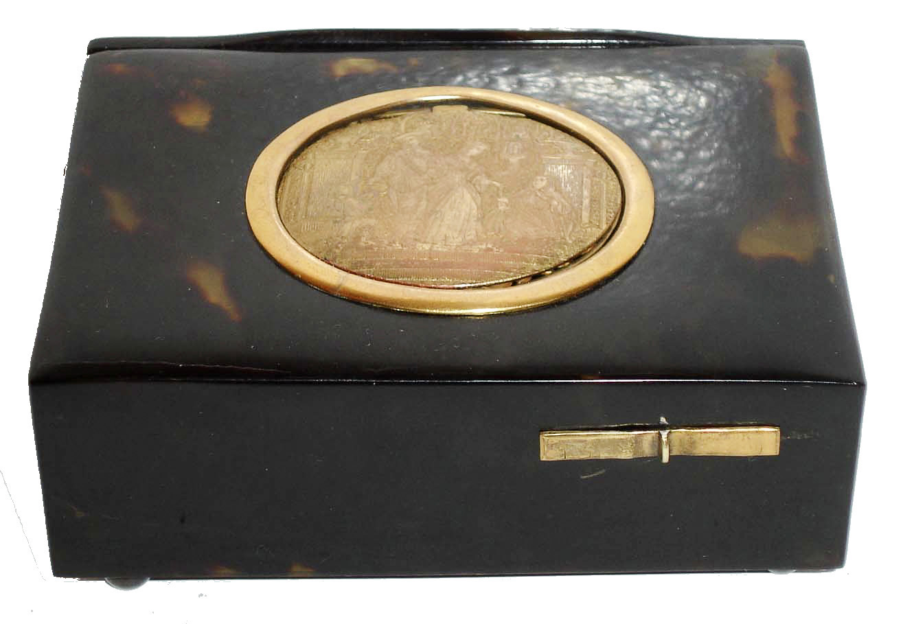 Singing bird box tabatiere, French or German, tortoise shell case with compartment for snuff or to keep the key, and gilt cover, engraved with a scene of a well dressed couple, their estate in the background, giving coins to the poor, the bird with orange, red, blue, green, and black feathers emerges and does his routine when the start slide is pushed, all on silver ball feet, c1890 — Antique Clocks Price Guide