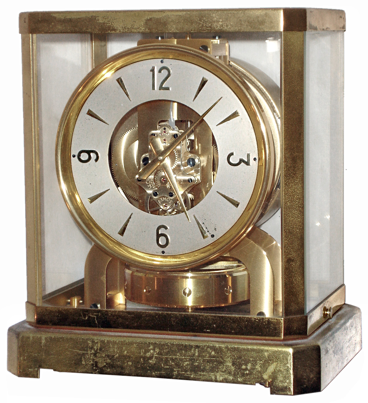 Jaeger-LeCoultre Swiss "Atmos" table clock, jeweled movement runs on changes of atmospheric pressure and temperature, gold-plated brass and glass case, serial number 33242, c1955- — Antique Clocks Price Guide