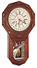 William L. Gilbert Clock Co., Winsted, Conn., "Star Drop Calendar" 8 day, time and strike,  calendar wall clock in walnut. c1883