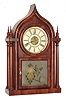 Brewster Manufacturing Co.,  Bristol,  Conn., 8 day, time, strike and alarm, four column O.G. Gothic or onion top shelf clock, c1853