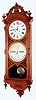 Ithaca Calendar Clock Co., Ithaca, N.Y., "No. 0 Bank", wall clock, 8 days, time and perpetual calendar, two weight driven movement in a walnut case with papered metal dials, dated 1879