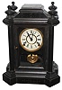 E. Ingraham Co., Bristol, Conn., "Domino" 8 days, time and strike, black painted wood mantel clock. c1885