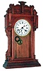 Waterbury Clock Co., Waterbury, Conn., "Niagara" walnut 8 days, time and strike, calendar shelf clock, c1911
