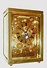 L'Epee, France, for Tiffany, 8 days, carriage clock with calendar, phases of the moon, and alarm, striking the hours and half hour on a gong, plain rectangular polished case, back and sides with beveled glasses, skeletonized, polished brass time, calendar and alarm dials with blued steel hands, gilt lever escapement platform with matte finish, c1980