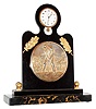 Angelus Watch Co., Switzerland, for Tiffany & Co., New York, golf themed desk clock with 8 days, minute repeating clock, the veined black marble base supporting an ebonized wood stand, mounted with a gilt repousse style plaque depicting a golfer putting, with two applied gilt branches with oak leaves above the plaque, and with clock mounted at the top, the 8 day, 15 jewel, minute repeating nickel plate movement with centrifugal governor, lever escapement with cut bimetallic balance, white enamel dial with Arabic numerals, signed "Tiffany & Co. 8 Days Repeater", with blued steel luminous hands, back of case dated May 14, 1932