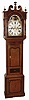 William Barton, Wigan, England, tall clock, 8 day, time, calendar, moon phase and bell strike movement in an oak case with broken arch, mahogany highlights and inlay and painted iron dial, c1850
