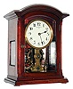 Eureka Clock Co, Ltd, London, England battery powered mantel clock with oversized balance wheel movement in an mahogany case with beveled glasses and cream enamel dial, c1906 s#7999