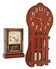 Clocks- 2 (Two): an E. Ingraham & Co. cottage clock with reverse painted tablet and a spring driven wall clock probably made by Sessions, c. 1915 for a retail firm.