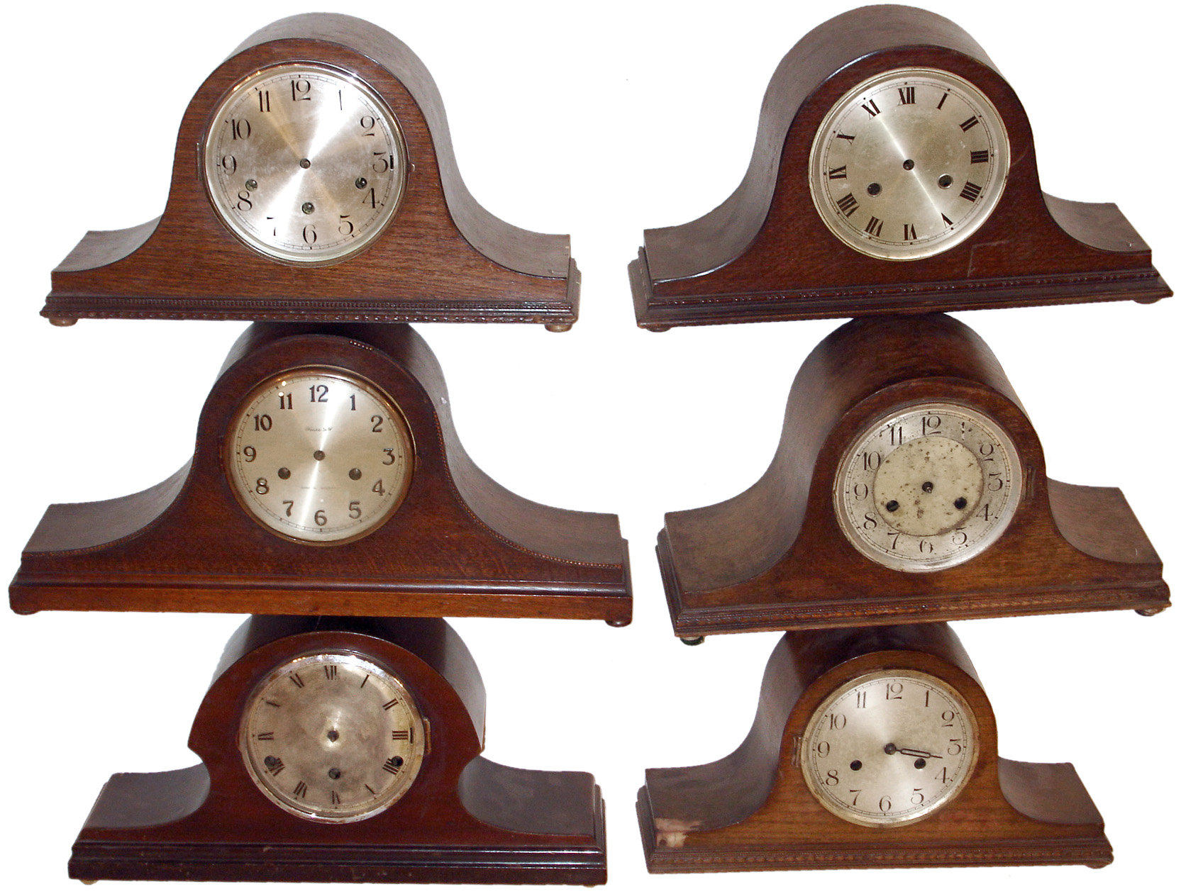 Clocks- 13 (Thirteen) Tambour German and English wood case 8 days, mantel clocks (6 three-train Westminster chime, 7 two train time and strike); 1 aneroid barometer on carved wood stand; one French front (no movement) for "Chocolat Revillon"; 1 porcelain Delft style wall clock with time-only pin-pallet works mounted behind; early 20th century — Antique Clocks Price Guide
