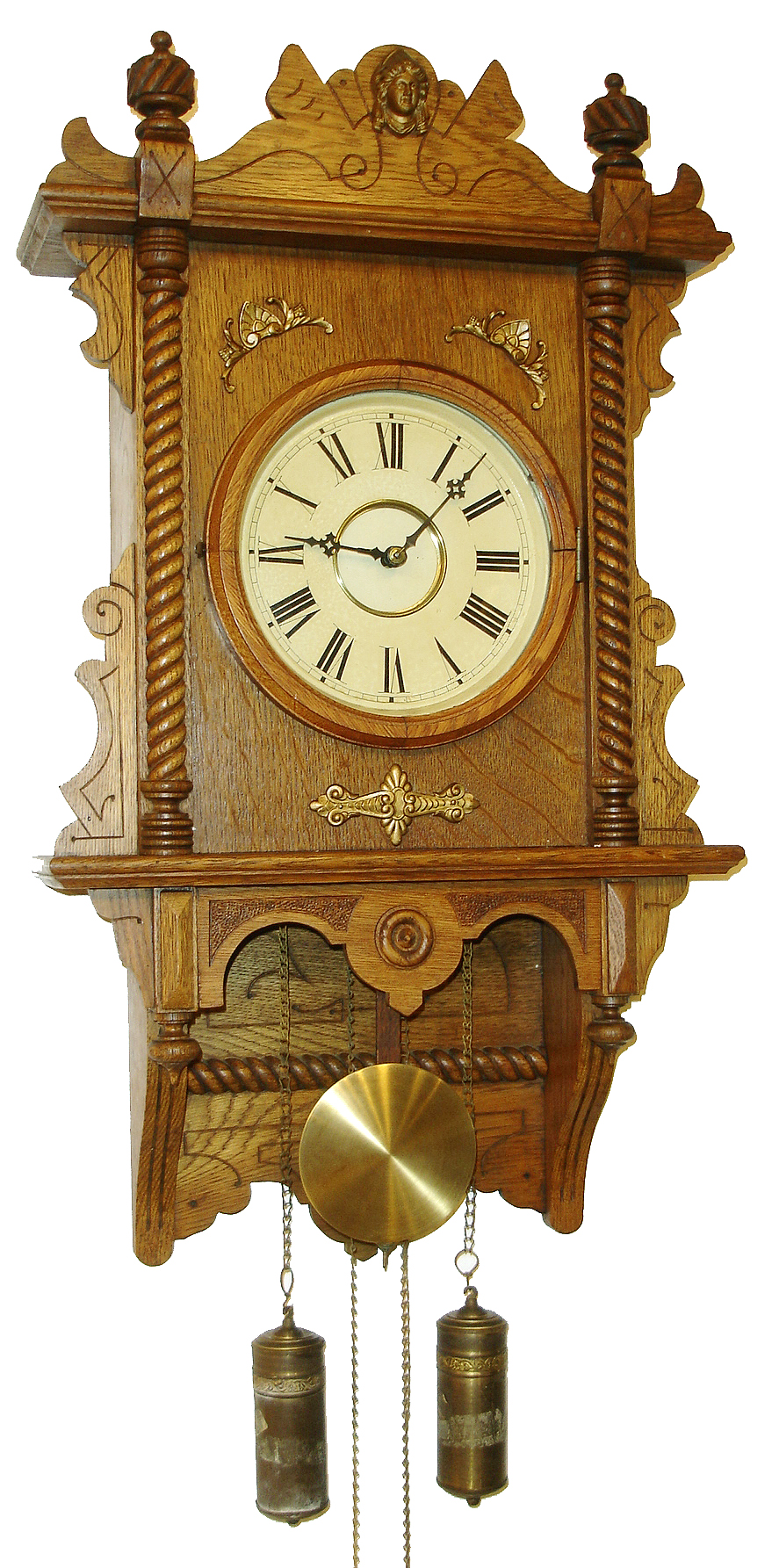 Waterbury Clock Co., Waterbury, Conn., "Study" variant wall clock, 8 days, time and strike, weight driven movement in an oak case with painted metal dial, c1910 — Antique Clocks Price Guide