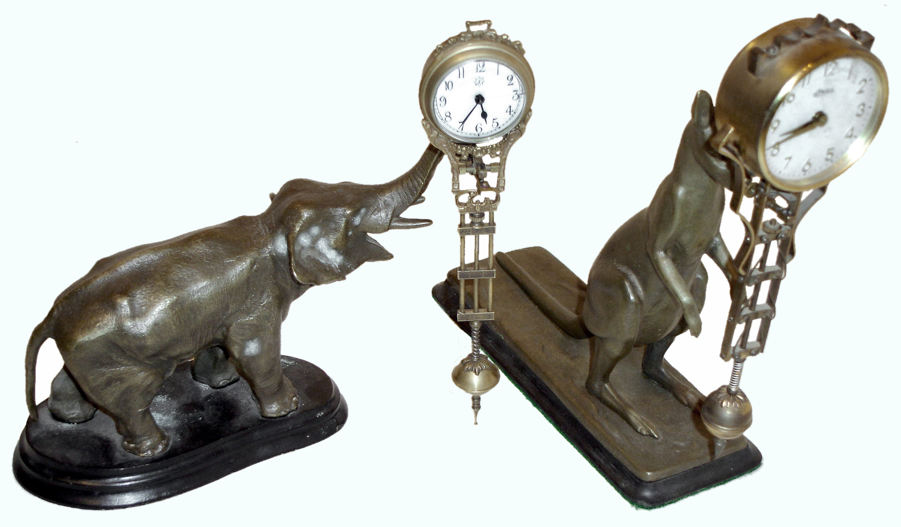 Clocks- 2 (Two) reproduction Swingers: signed "Linden" and Junghans "J", with modern kangaroo and possibly period elephant bases — Antique Clocks Price Guide