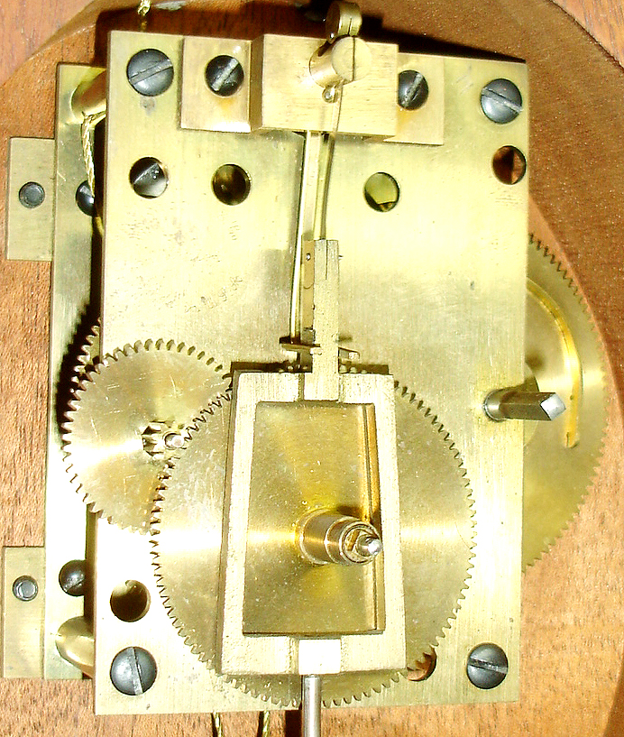 E. Howard & Co., Boston, reissue presentation banjo wall clock, mahogany case with line inlay and cross banding with carved bracket, acorn drop and with eagle finial, Mt. Vernon tablet and Washington portrait throat glass, brass bezel and side arms, convex glass, Roman numeral white painted metal dial, brass timepiece movement with uncrossed wheels, lead weight, brass pendulum, movement number M5B55, c1990 — Antique Clocks Price Guide