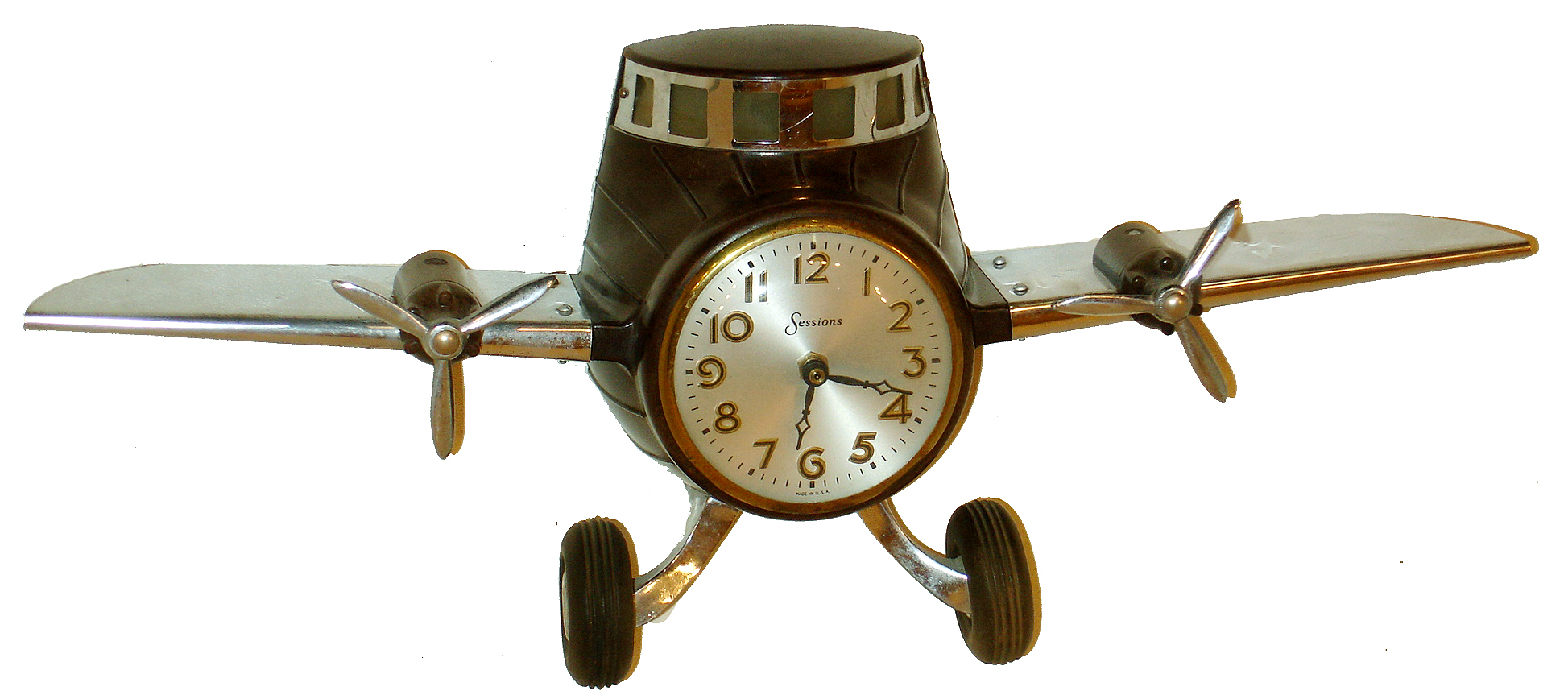 Sessions Clock Co., Forestville, Conn., airplane form desk clock, converted to quartz battery movement. — Antique Clocks Price Guide
