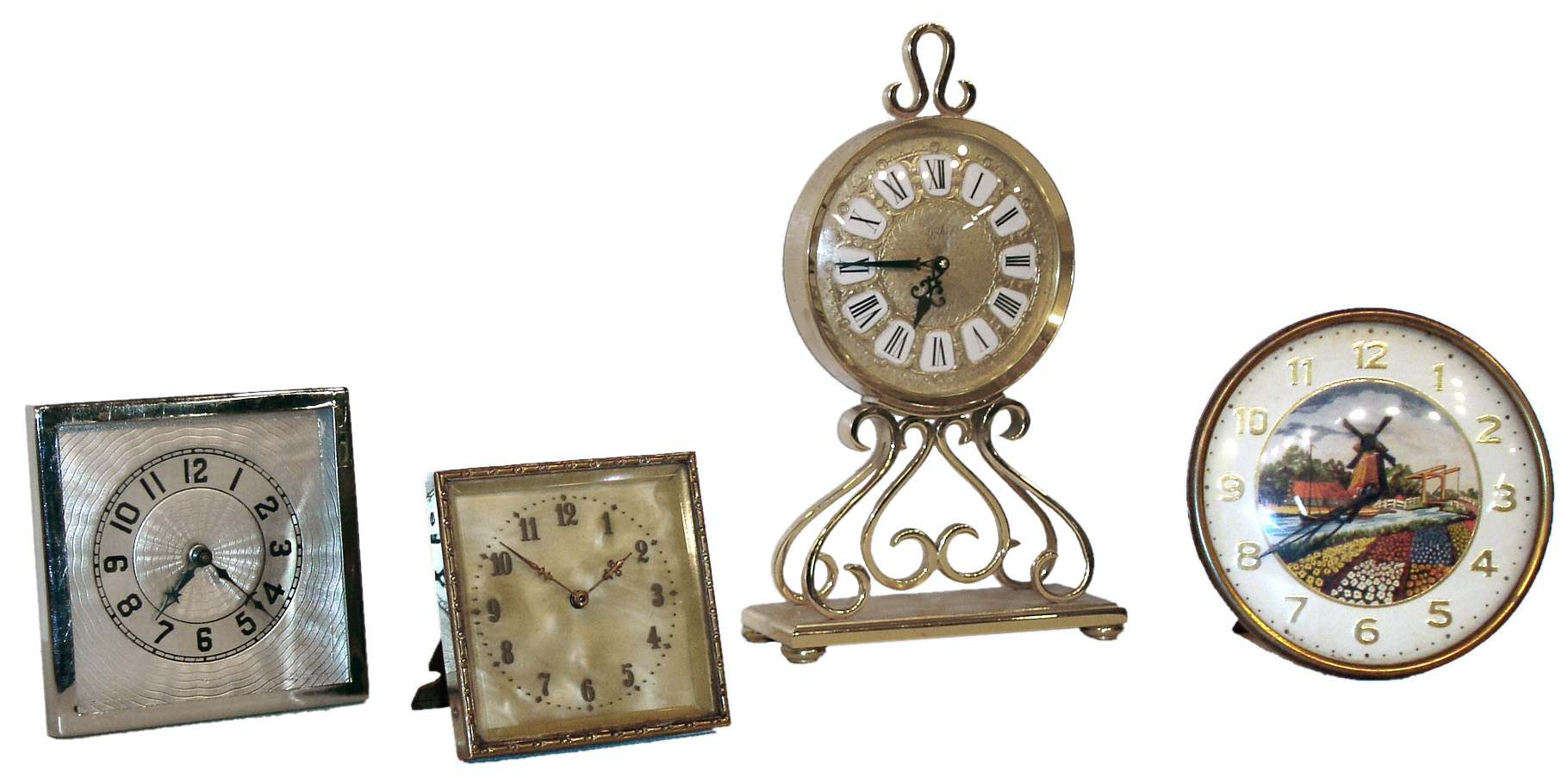 Clocks- 4 (Four) novelty and desk time only clocks: Imhof Swiss 15 jewel polished brass desk clock; round 30 hours, strut clock with animated windmill; square strut 30 hours, clock with pearlescent dial; and Lux square chrome 30 hours, strut clock, 20th century — Antique Clocks Price Guide