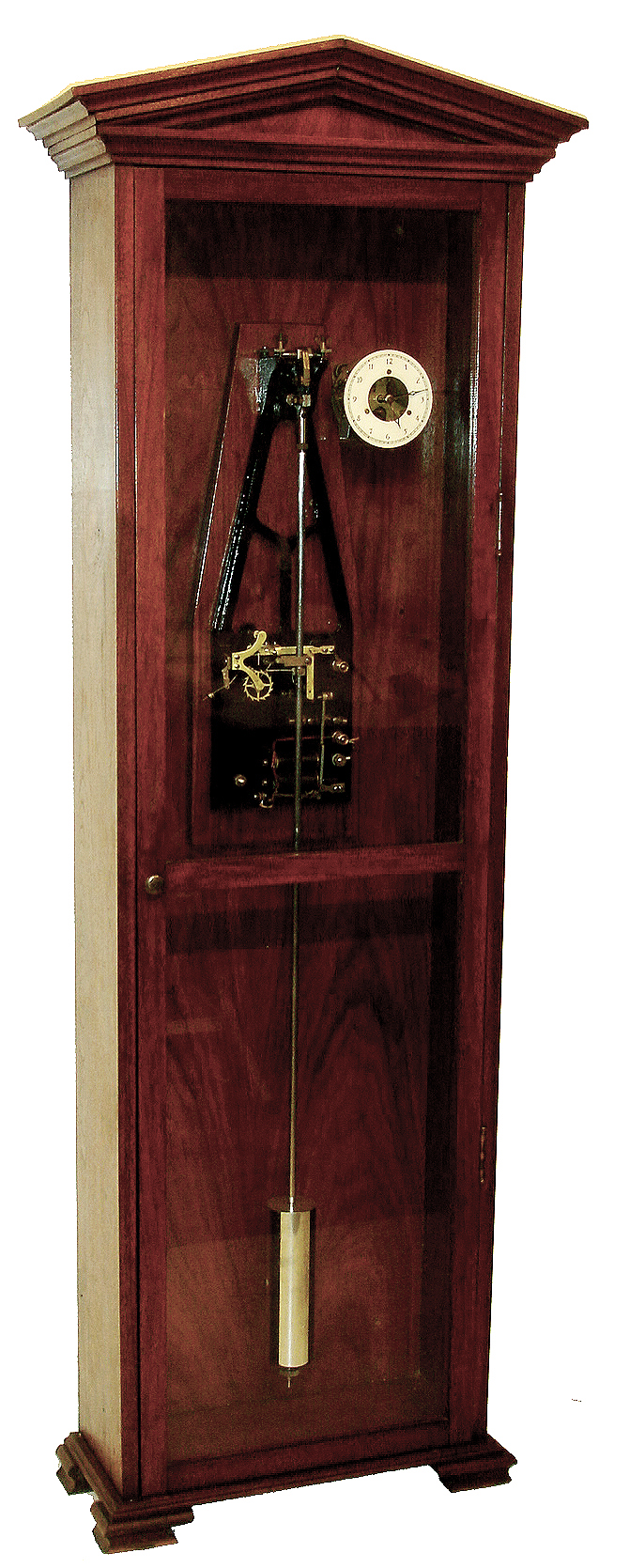 The Synchronome Co., Ltd., England, master clock with gravity remontoire driven pendulum, the falling lever providing impulse at 30 second intervals, home made mahogany floor standing case with pediment top, glazed door, iron bracket mounted to case back for pendulum, remontoire, and contacts, seconds beating pendulum with pan for fine regulating weights, dial and movement to right of pendulum suspension, c1940 — Antique Clocks Price Guide