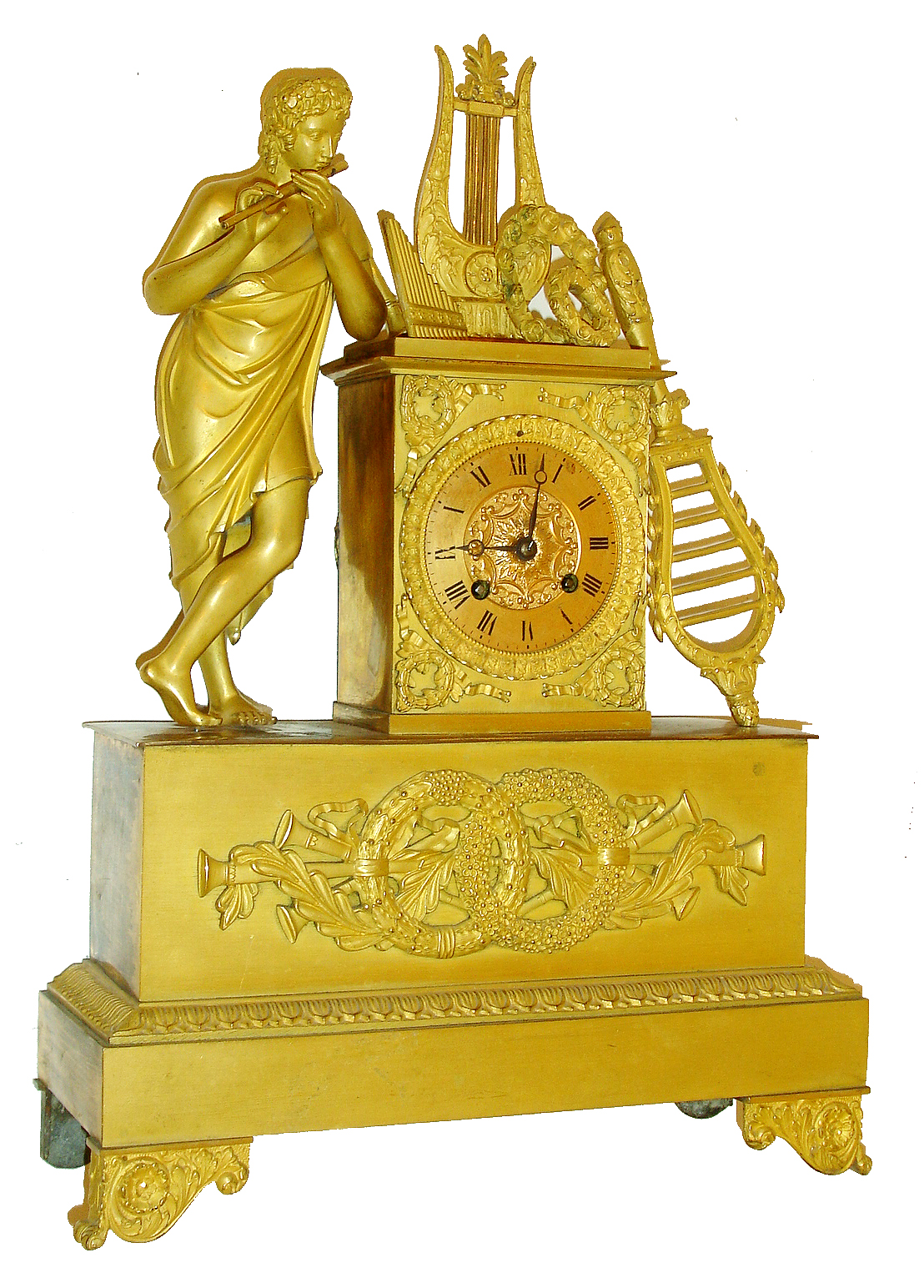 French gilt bronze figural mantel clock, robed male figure playing a flute and with lyre, pan flute, other wind instruments and floral wreaths, Roman numeral gilt dial with acanthus surround, base with trophy composed of wind instruments, laurel, and interlocking wreaths, with acanthus and floral medallion decorated scroll feet, 8 days, time and strike, Pendule a Paris movement with silk thread suspension, blued steel Breguet style hands, c1830 — Antique Clocks Price Guide