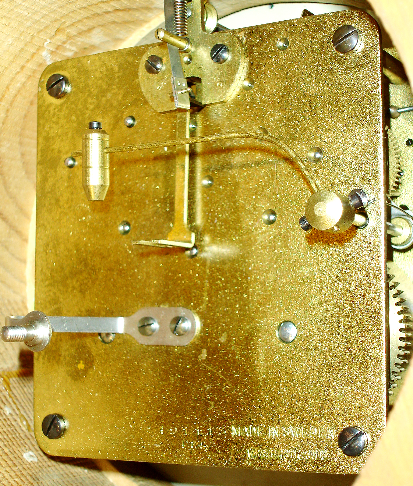 Postwar Swedish cartel clock, gilt case with carved roses, swags, and bowknot, brass bezel with convex glass, Arabic numeral, white painted metal dial, Louis XV style hands, 8 days, spring driven time and strike, movement, c1950. — Antique Clocks Price Guide