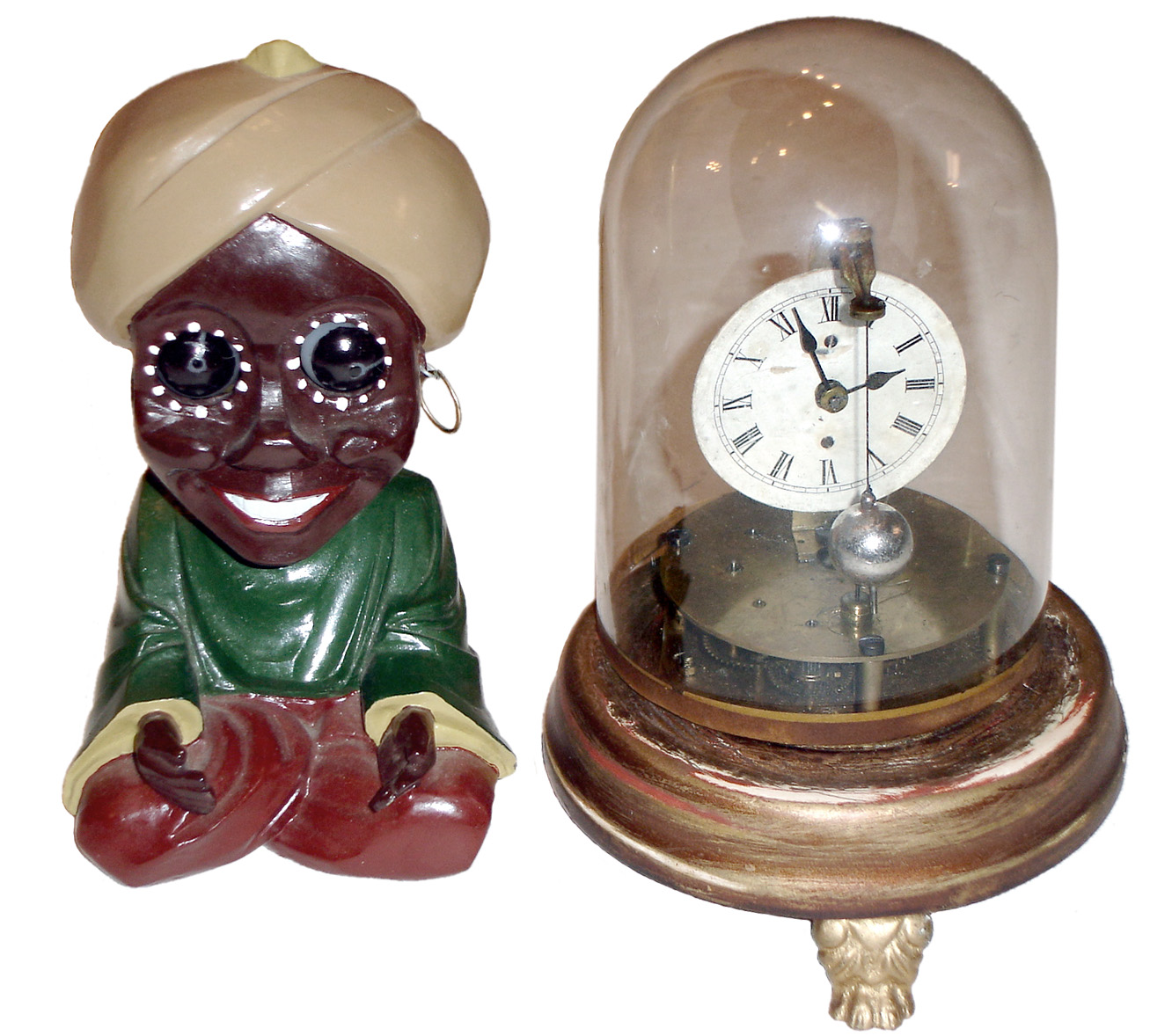 Clocks- 2 (Two) 30 hours, novelty timepieces: Briggs rotary, c1878, with glass dome; "Genie" rotating eye, cast metal reproduction — Antique Clocks Price Guide