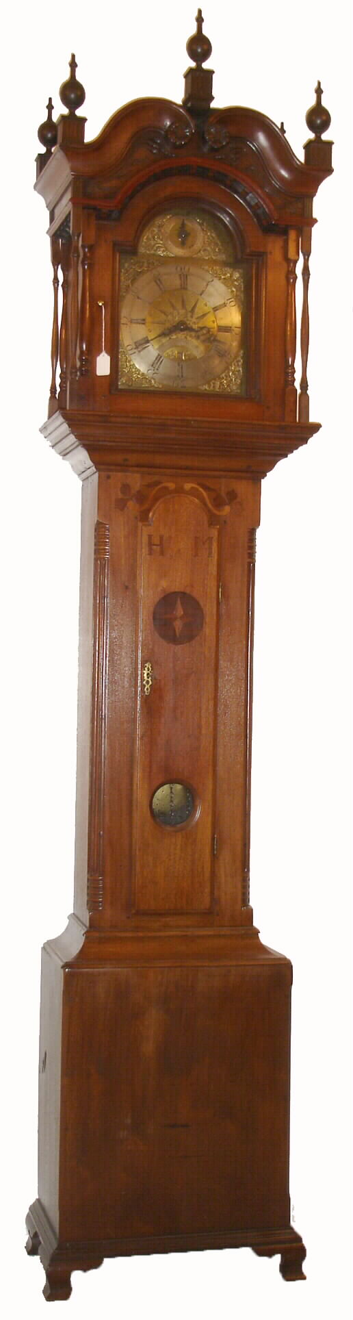 Henry Gotshalk, Allentown, PA, inlaid walnut cased tall clock, with dentil work, bonnet top, 5 finials, and carvings. This is a 30 hours, arched brass dial, with compass motif, and with strike / silent dial in the arch, & calendar aperture above 6, from the Doug Shaffer collection, c1765 — Antique Clocks Price Guide