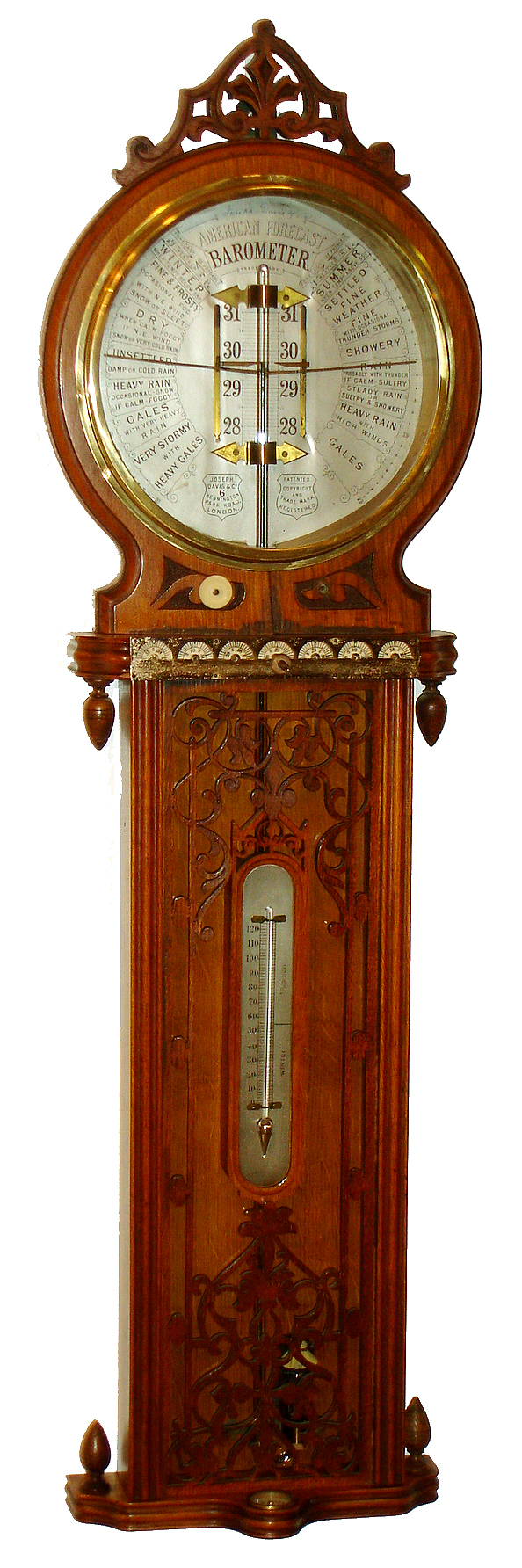 Joseph Davis & Co., 6 Kennington Park Road, London, England, "American Forecast Barometer", large bore mercury tube, thermometer, compass, and seven dials (one for each day of the week) to record barometric pressure in an ornate highly carved hard wood case with elaborate fretwork on inside and outside of lower glass, silvered dial and thermometer and ivory daily dials, c1890 — Antique Clocks Price Guide