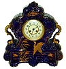 French mantel clock, cobalt blue glazed earthenware case with gilt ornament marked "England", Arabic numeral white enamel dial with sunk center, blued steel trefoil hands, gilt bezel with convex beveled glass, square plate 8 days, time and strike, movement, c1910