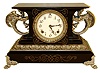 Ansonia Clock Co., New York, "Belgium" enameled iron 8 days, time and strike, mantel clock with ornate cast metal feet, handles and moldings, c1904