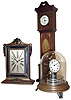 Clocks- 3 (Three) time-only desk clocks: Waltham polychrome 8 days, library clock; Horolovar reproduction of Briggs Rotary; and Ansonia 8 days, miniature inlaid mahogany grandfather clock