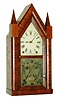 Brewster & Ingrahams, Bristol, Conn., steeple or "Sharp Gothic" mantel clock, 8 days, time and strike, Kirk's Patent repeating brass movement with cast iron back plate in a mahogany veneer case, painted metal dial and etched lower glass, c1844