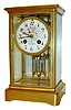 French crystal regulator for Camerden & Forster, New York, gilt brass case with beveled glasses, Roman numeral white enamel dial, decorated with a cherub bearing a garland of flowers, gilt hands, faux mercury pendulum, 8 days, time and strike, Pendule a Paris movement marked S. Marti, c1900
