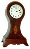 Eureka Clock Co., Ltd., London, 1000 day electric clock in a mahogany veneered Sheraton style balloon case, with line inlays, cross banding and marquetry conch shell, brass bezel with convex beveled glass, Arabic numeral white enamel dial signed "Eureka Clock Co., Ltd., London, 1000 Day Electric Clock", blued steel spade hands, spotted brass movement with large bimetallic balance, the rating assembly accessed through a brass cover in the case back, serial #2847, c1910