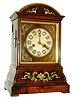 Johann Baptist Beha, Eisenbach, unusual early shelf cuckoo for the English market, Brazilian rosewood veneered case with inlays of brass, pewter, and turtle shell, alabaster dial with Roman numerals on ceramic cartouches, each with its own ornamental gilt frame, dial with veneered and inlaid surround, blued steel hands, 8 days, fusee time and strike, movement with wooden plates, wooden pipes with marbled paper covering, inside of back with Beha label, and date 7/2/69, and also the label of Camerer Cuss, the clocks retailer