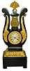 French mantel clock, ebonized wooden lyre form case with pendulum oscillating behind the "strings", ornamented with gilt mounts of waterleaf, horn of plenty and with an overflowing fruit basket at top, petal form bezel with floral ornament, pendulum decorated with cornucopiae, swans, acanthus, and with central floral medallion, 8 days, time and strike, Pendule a Paris movement, Roman numeral, engine turned silvered dial, blued steel Breguet style hands, c1830