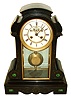 French black slate mantel clock, the front with malachite inlays and gilt incised line decoration, gilt bezel case front and back with beveled glass, Roman numeral white enamel dial with recessed center, and exposed Brocot escapement, blued steel Breguet style hands, 8 days, time and strike, Pendule a Paris movement marked S. Marti, pendulum with large brass ball and steel rod, c1880