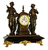 Mantel clock, black enameled iron case now with French movement, case with incised line decoration, gilt spelter mounts, patinated spelter female figures and case, gilt bezel, Roman numeral white enamel dial, blued steel Breguet style hands, 8 days, time and strike, movement, c1880