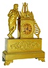 French gilt bronze figural mantel clock, robed male figure playing a flute and with lyre, pan flute, other wind instruments and floral wreaths, Roman numeral gilt dial with acanthus surround, base with trophy composed of wind instruments, laurel, and interlocking wreaths, with acanthus and floral medallion decorated scroll feet, 8 days, time and strike, Pendule a Paris movement with silk thread suspension, blued steel Breguet style hands, c1830