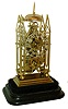 J. Smith and Sons Clerkenwell, [attributed] skeleton clock, cathedral form plates with delicate piercing and decorative turned baluster form pillars, on ball feet and with stepped base, engraved Roman numeral silvered dial with pie crust edge, blued steel hands, brass pendulum with decorative star form steel ornament at center, 8 days, single fusee movement with recoil escapement and passing strike, all mounted to a velvet lined ebonized wooden base with glass dome, c1850