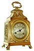 French pendule d' officier style travel clock, brass case with classically inspired ornament, resting on paw feet, engine turned bezel with convex glass, Arabic numeral, engine turned silvered dial signed "Paul Garnier", blued steel Breguet style hands, 8 days, time and strike, round movement with lever platform, c1890