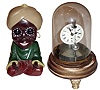 Clocks- 2 (Two) 30 hours, novelty timepieces: Briggs rotary, c1878, with glass dome; "Genie" rotating eye, cast metal reproduction
