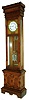 William L. Gilbert Clock Co., Winsted, Conn., "Regulator No. 12 Standing" tall clock, 8 days, time only, weight driven American movement with deadbeat anchor escapement, maintaining power, sweep seconds and a three glass vial mercury pendulum in an oak case with burled frame around door and burled recessed interior panel and white enamel dial, c1895
