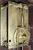 Simon Willard, Roxbury, Mass., 8 days, weight, T-bridge, step train, dead beat escapement brass movement mahogany banded case patent or banjo timepiece, c1805. Throat door held onto the case with four screws. Dial fastened with two L-turns. Rabbeted throat frame. Mahogany backboard. The bottom panel in the base is dovetailed to the sides. A picture of a similar movement with the decorative click is pictured in "Willard's Patent Timepieces" by Paul Foley, pg 22