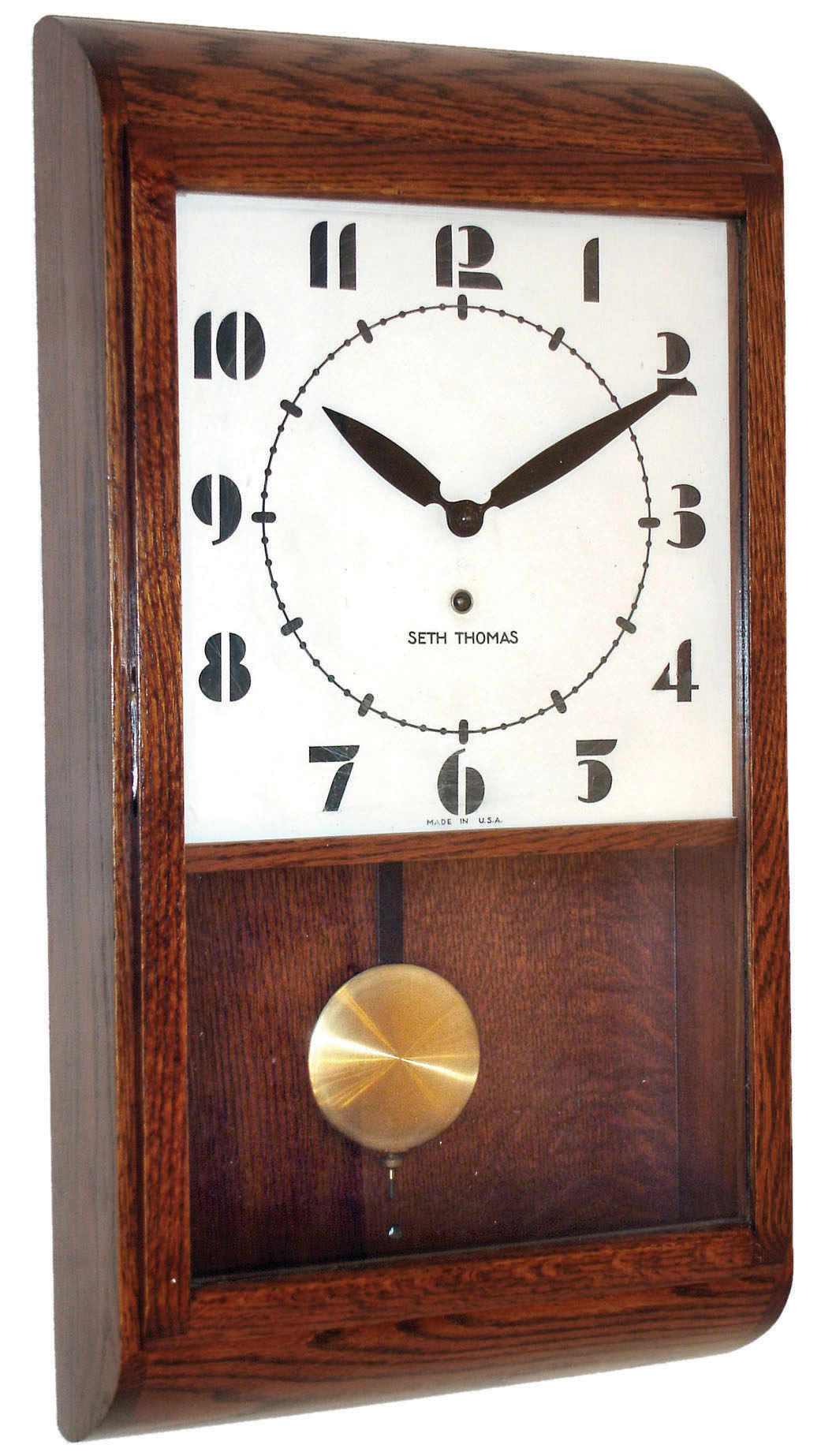 Seth Thomas Clock Co., Thomaston, Conn., Deco-style 8 days, time only, oak wall clock dated 1946 — Antique Clocks Price Guide
