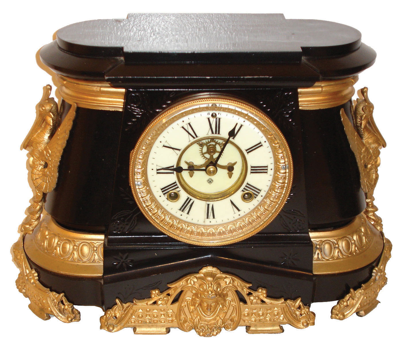 Ansonia Clock Co., New York, "Pompeii" model spring driven 8 days, time and strike, (hour & half hour on gong) clock in an enameled iron case with a porcelain dial, visible escapement and white metal style case ornaments, c1904. — Antique Clocks Price Guide