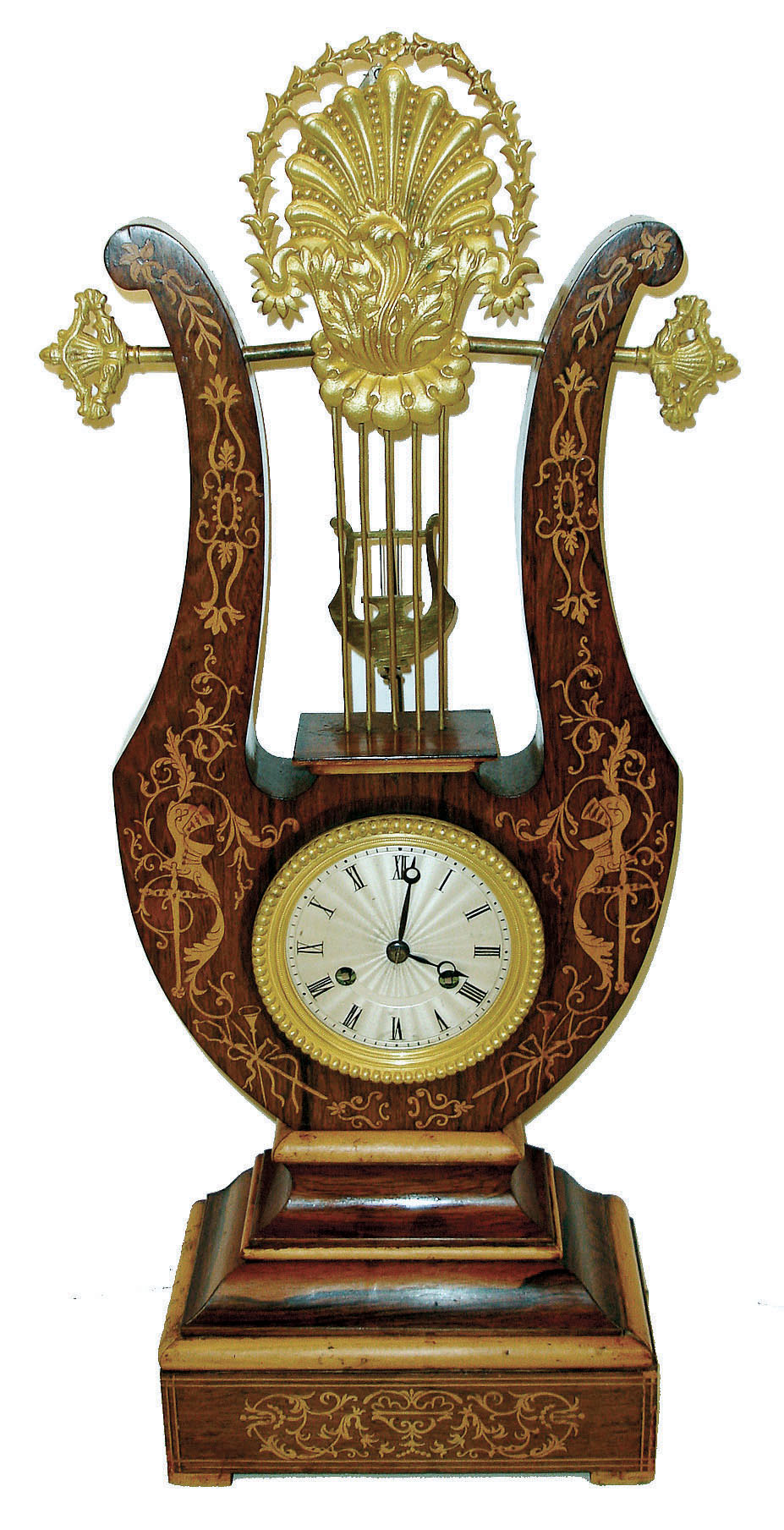 Grange & Betout a Paris, inverted lyre clock, rosewood veneered case with light wood inlays and moldings, top with gilt shell and leaf form ornament, gilt beaded bezel, Roman numeral silvered dial with engine turning, blued steel Breguet style hands, lyre form pendulum swinging above the dial and behind lyre strings, 8 days, time and strike, pendule a Paris movement signed "Grange & Betout A Paris", c1860 — Antique Clocks Price Guide