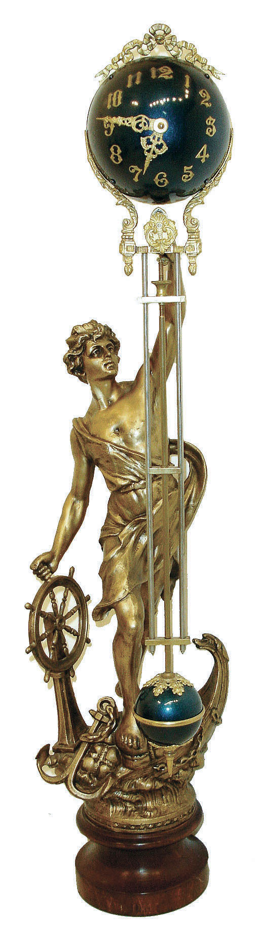 France, figural swinging clock, the male figure standing at the bow of his sailing vessel, with one hand on the wheel, the other held aloft and supporting the clock, mounted to a turned wooden base, now with a later 20th century reproduction 8 day time only, ball style swinging clock — Antique Clocks Price Guide