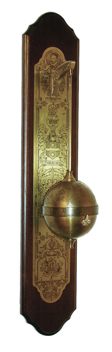 Thwaites & Reed, England for the Franklin Mint, Sir Francis Drake falling ball gravity clock, the spherical weighted engraved brass case containing the 8 day timepiece movement and with annular time display, suspended from a bracket affixed to a wall mounted board with engraved ornamental brass back plate, c1980 — Antique Clocks Price Guide