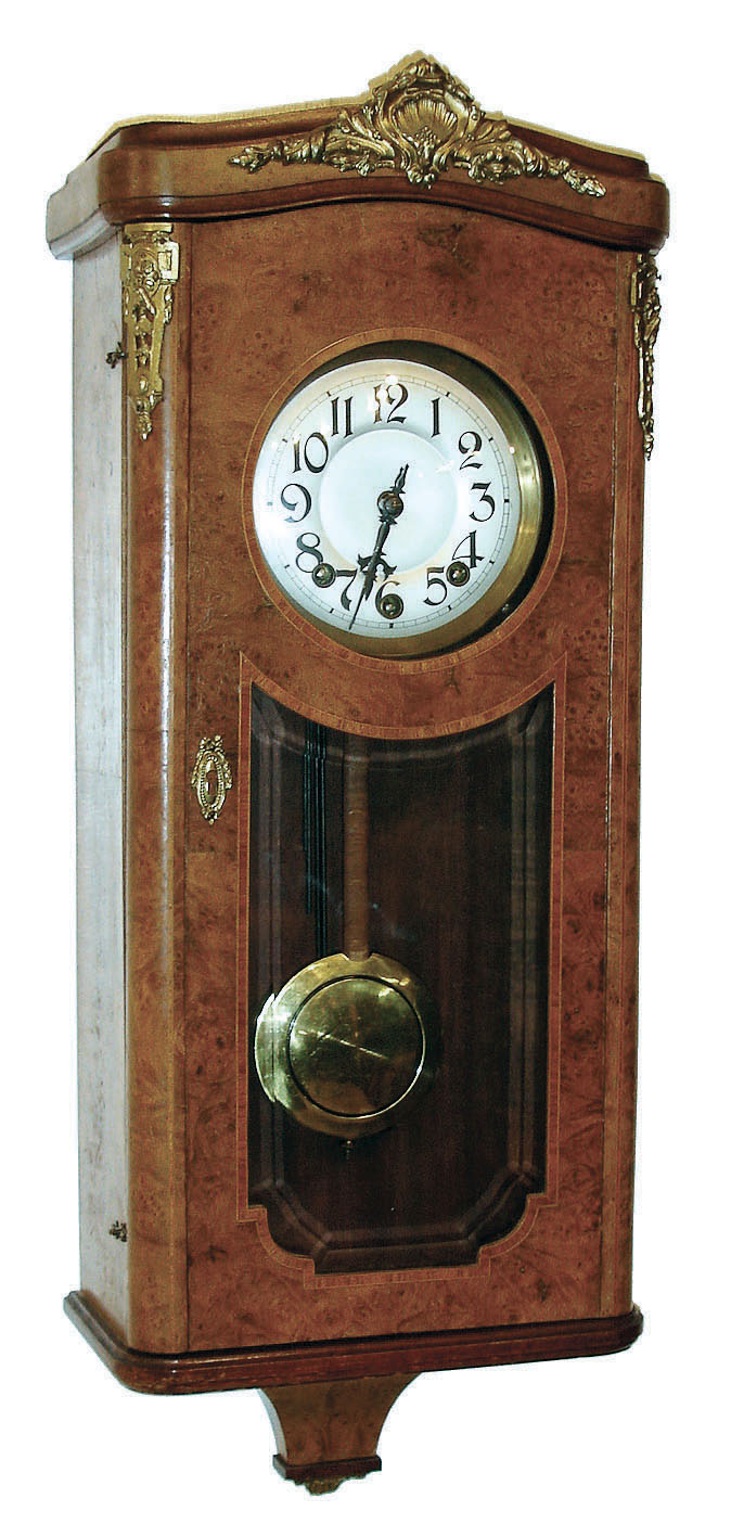 France, wall clock, burl walnut veneer with tulipwood banding and cast mounts, glazed front with beveled glass, unusual spring driven Morbier style 3 train 8 days, time and strike, movement with separate chime module, Arabic numeral silvered dial, black painted steel hands, c1920 — Antique Clocks Price Guide