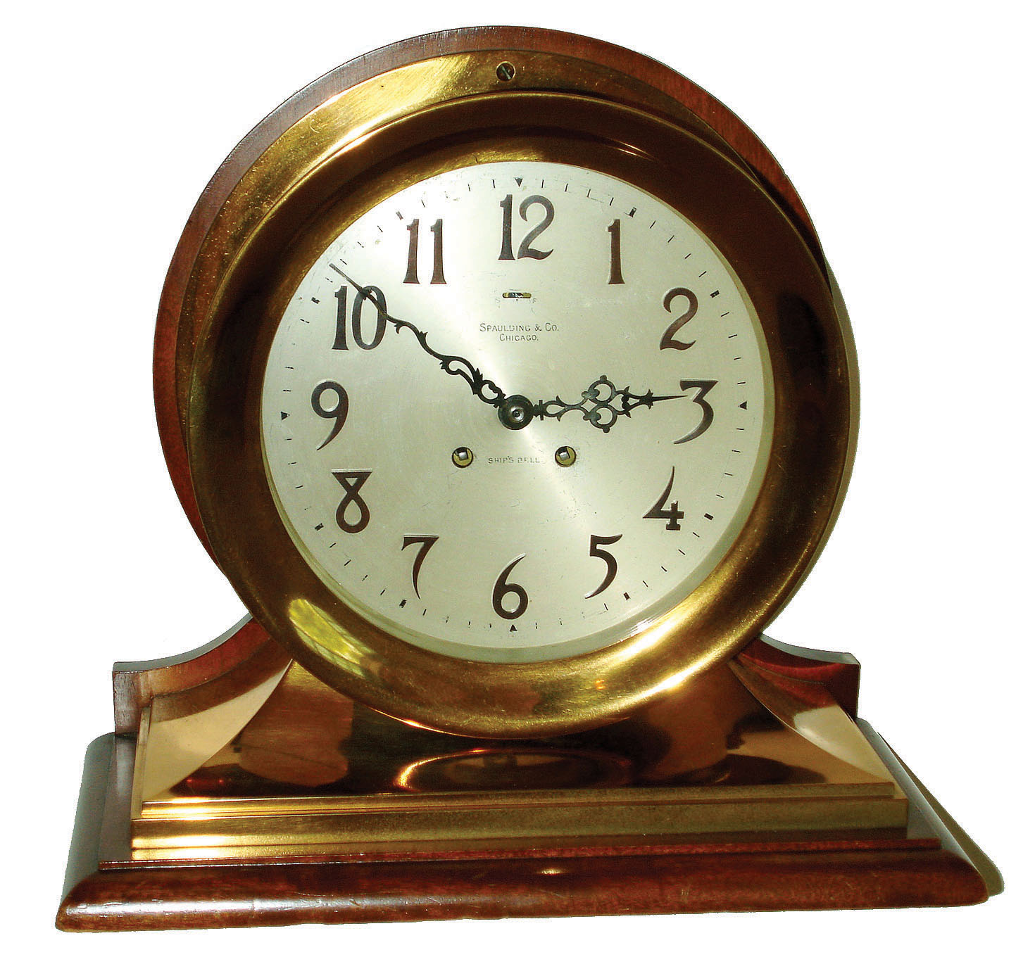 Chelsea Clock Co., Boston, "Commander" 8 1/2" dial 8 day ship's bell striking brass case on mahogany base mantel clock retailed by Spaulding & Co., Chicago, 1908. — Antique Clocks Price Guide