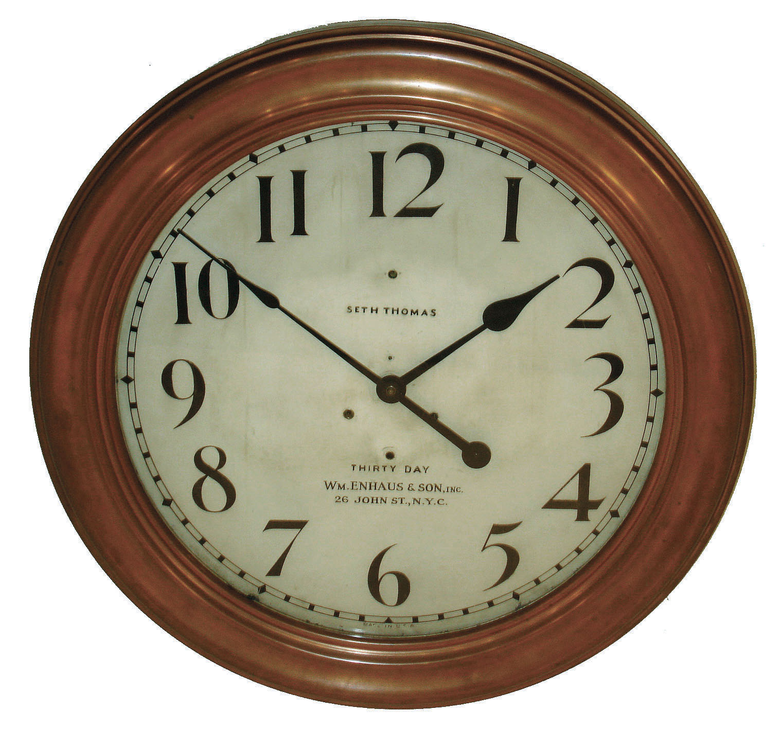 Seth Thomas Clock Co., for "Wm. Enhaus & Son, Inc., 26 John St., N.Y.C." 30 day time only, round copper-clad gallery clock with #86U twin-spring time only, movement, c1910 — Antique Clocks Price Guide