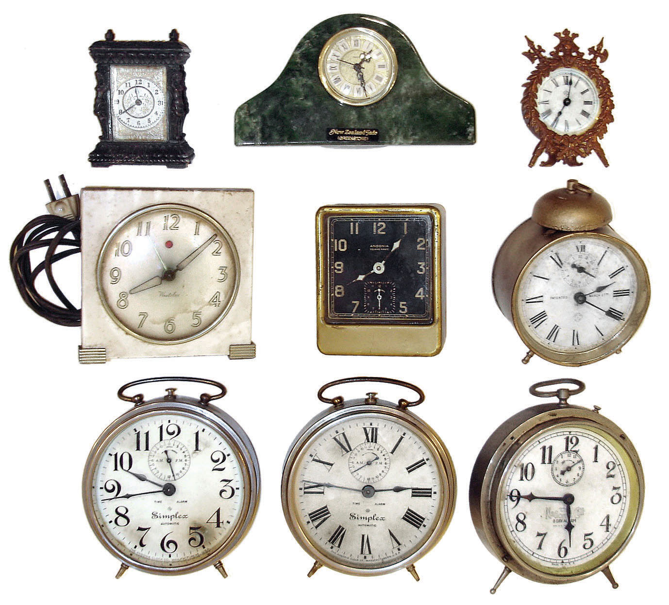 Clocks- 9 (Nine) alarm & novelty clocks: quartz in "New Zealand Trade Greenstone"; two Ansonia "Simplex" alarms; cast metal disk timepiece; Ansonia armorial novelty timepiece; "National Call" alarm; Westclox plug-in electric alarm; Ansonia "Square Pirate" alarm; Ansonia round alarm; early 20th century. — Antique Clocks Price Guide